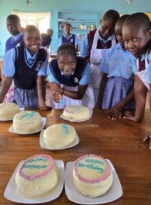 Home science students decorating cakes