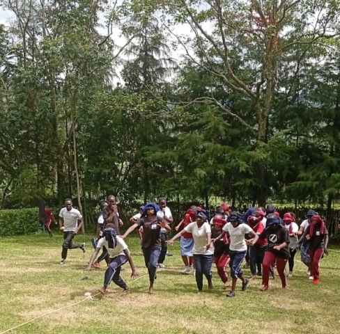 Girls playing a game during the retreat before exams