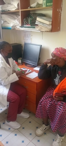 A local elder listens to instructions on the importance of taking medications as prescribed by a doctor/nurse.